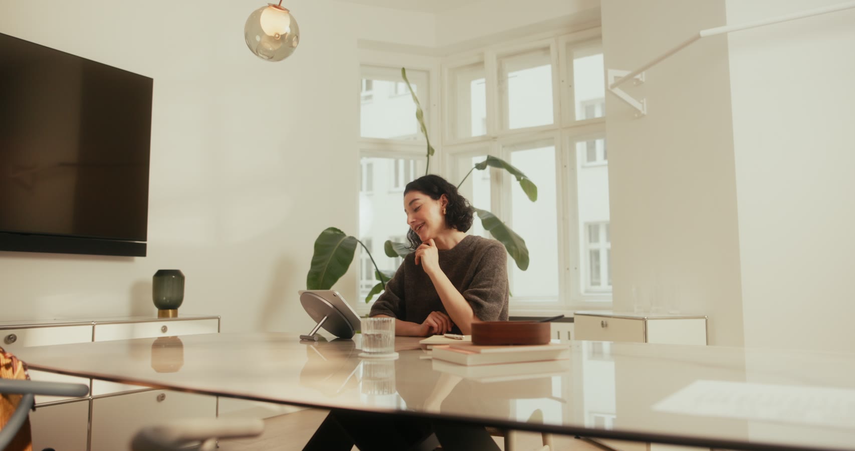 Tablet on an architectural wall mount in a bright interior
